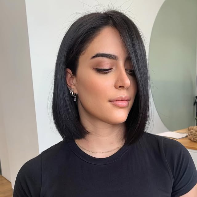 Short dark hair, chin-length bob
